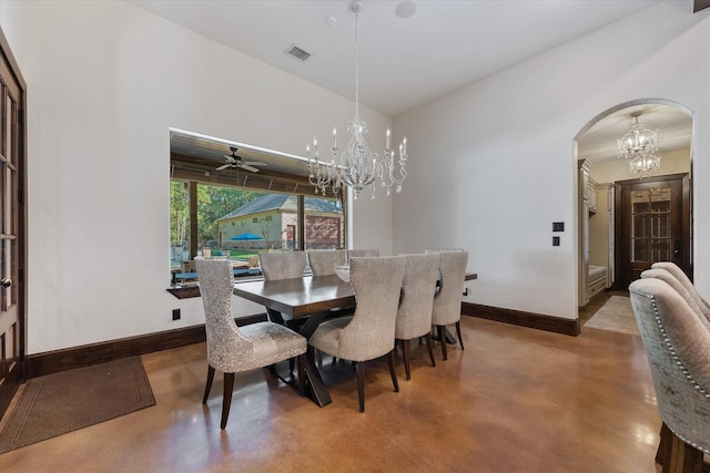 dining space with ceiling fan and concrete flooring