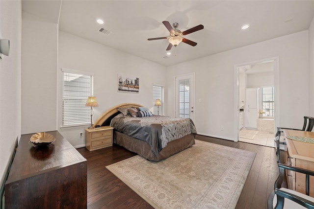 bedroom featuring connected bathroom, dark wood-type flooring, and ceiling fan