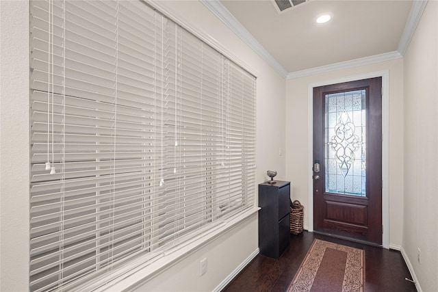 foyer entrance featuring crown molding and dark hardwood / wood-style flooring