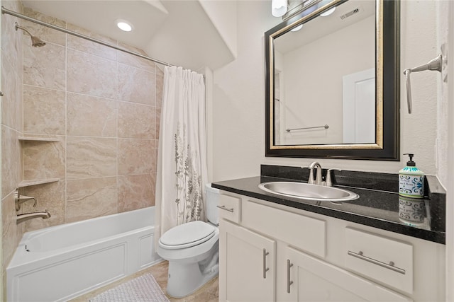 full bathroom featuring vanity, shower / bath combination with curtain, and toilet