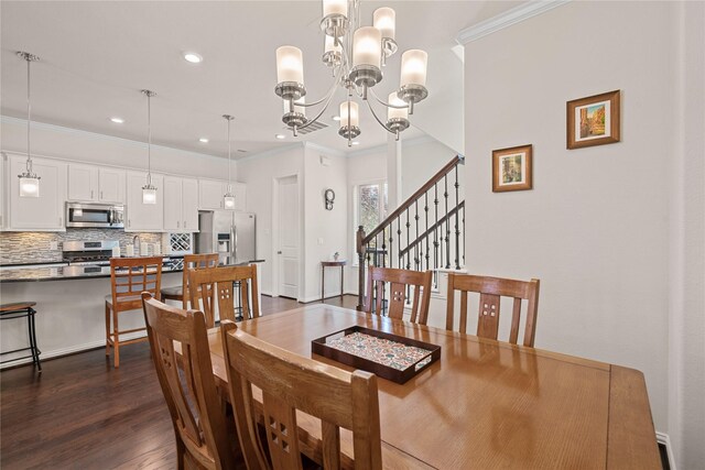 dining space with crown molding, dark hardwood / wood-style flooring, and an inviting chandelier