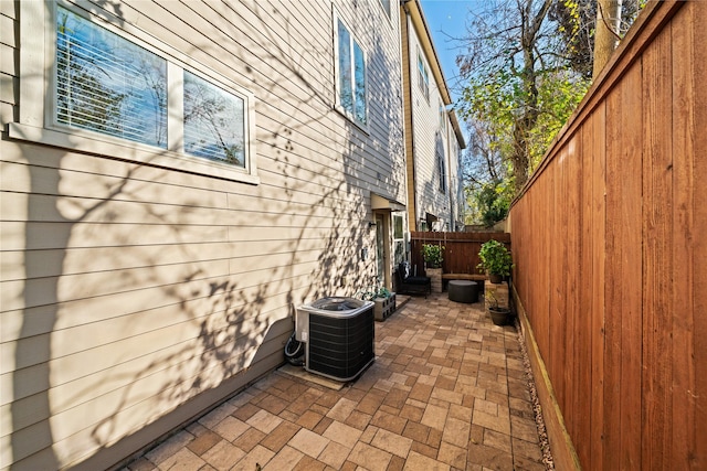 view of home's exterior featuring central AC and a patio