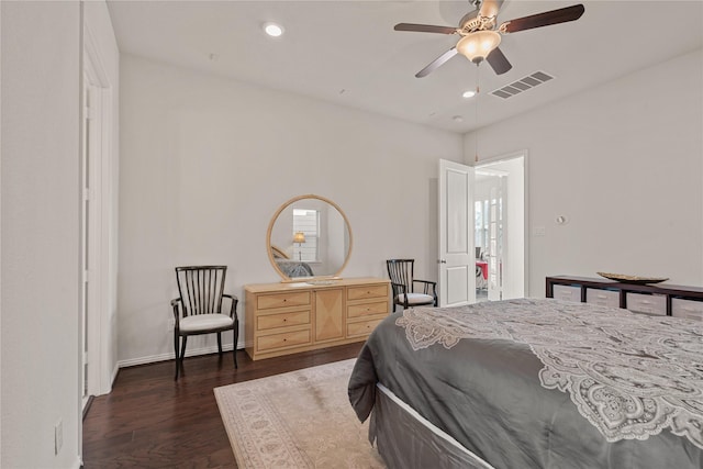 bedroom with dark wood-type flooring and ceiling fan