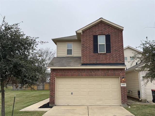 front facade with a garage and a front yard