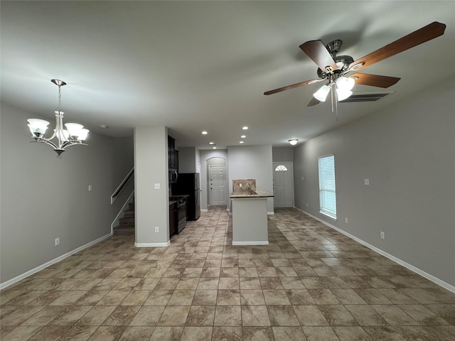 kitchen with ceiling fan with notable chandelier, hanging light fixtures, and range with gas cooktop