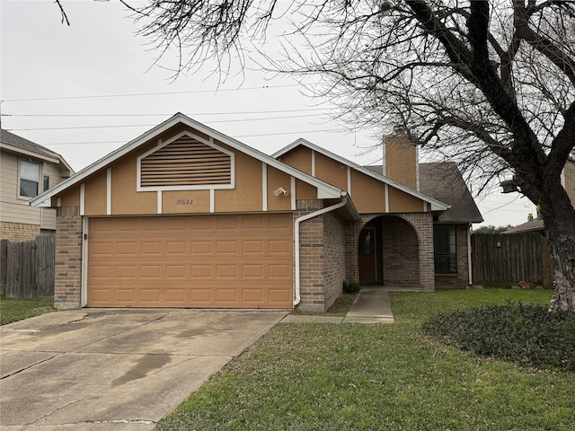 view of front facade with a garage and a front yard