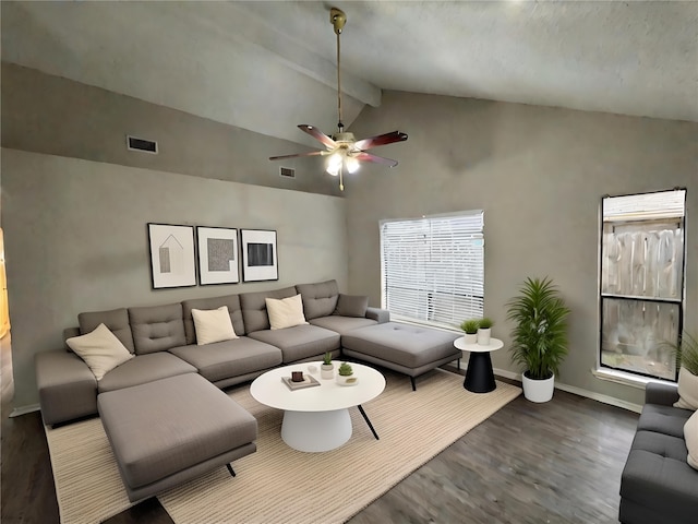 living room with ceiling fan, wood-type flooring, and vaulted ceiling with beams