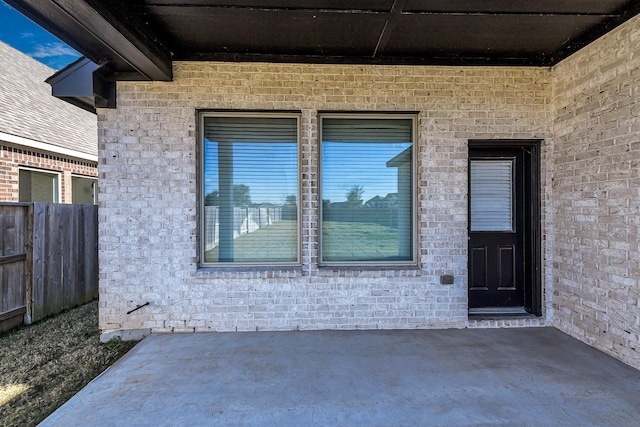 property entrance featuring a patio