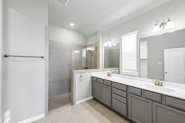 bathroom featuring vanity and a tile shower