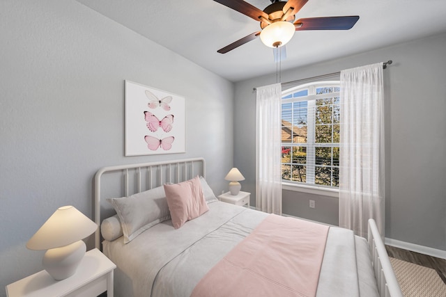 bedroom featuring ceiling fan and hardwood / wood-style floors