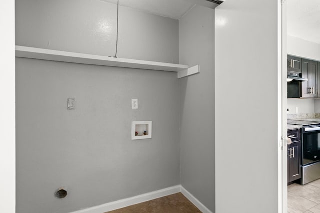 washroom featuring light tile patterned floors, hookup for an electric dryer, and hookup for a washing machine