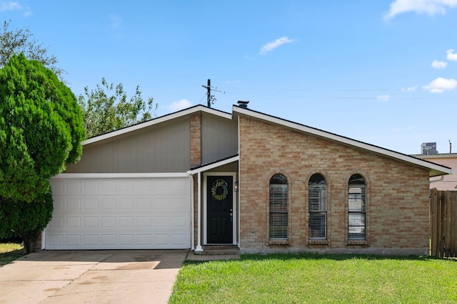 view of front facade with a front lawn and a garage