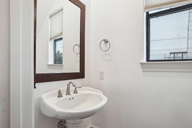 bathroom featuring sink and a wealth of natural light