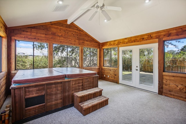 sunroom / solarium with french doors, ceiling fan, a jacuzzi, and lofted ceiling with beams