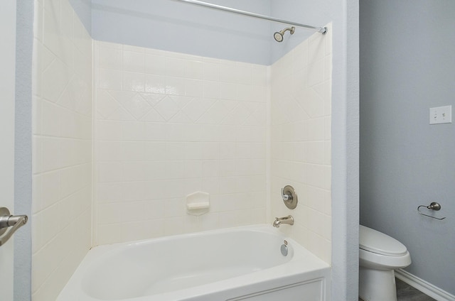 bathroom featuring toilet and shower / tub combination