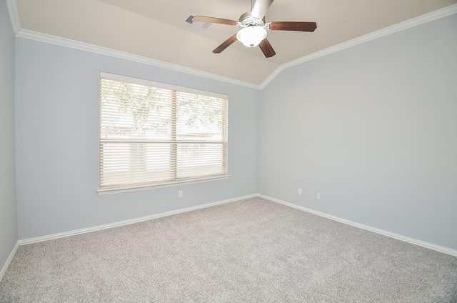 carpeted empty room with ceiling fan, ornamental molding, and lofted ceiling