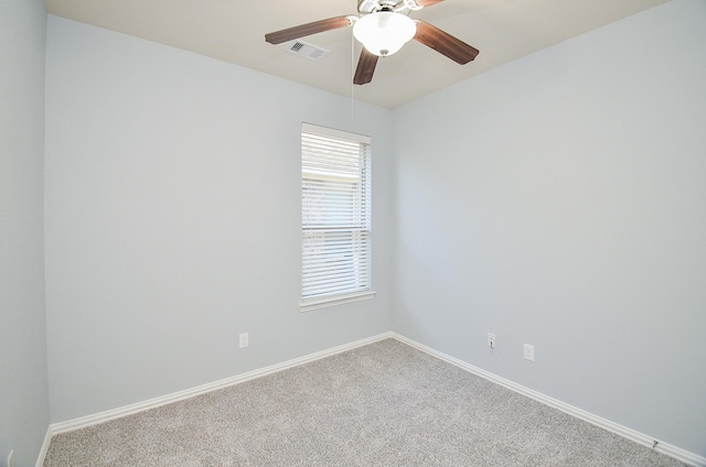 unfurnished room with ceiling fan and carpet flooring