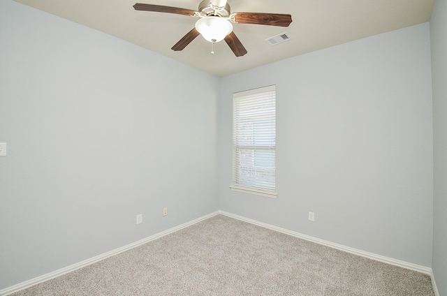 carpeted empty room with ceiling fan