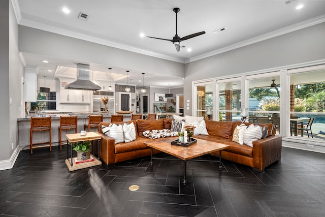 living room featuring ceiling fan, crown molding, and dark parquet floors