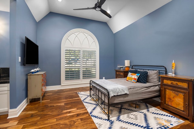 bedroom featuring ceiling fan, vaulted ceiling, and dark hardwood / wood-style flooring