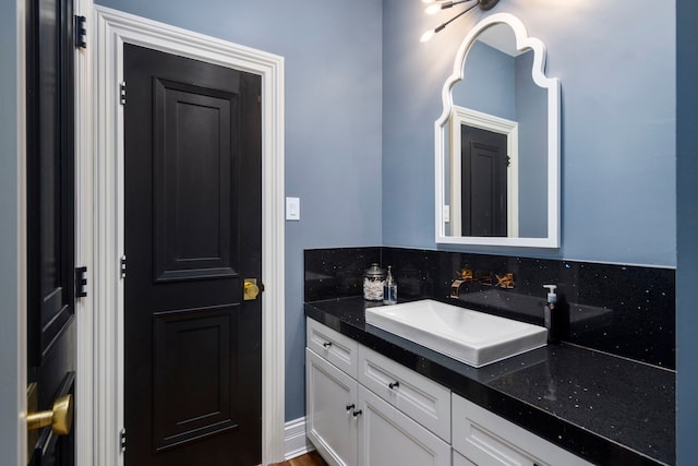 bathroom with backsplash and vanity