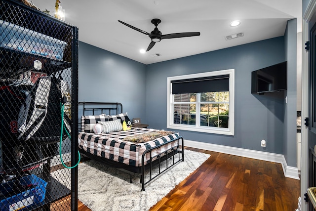 bedroom featuring ceiling fan and dark hardwood / wood-style floors