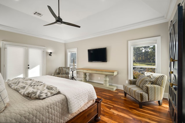 bedroom featuring ceiling fan, dark hardwood / wood-style flooring, and ornamental molding