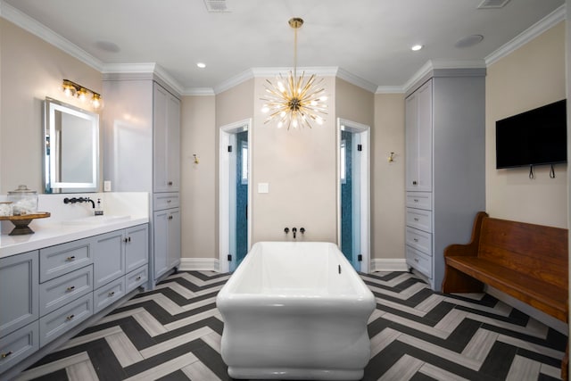 bathroom featuring a tub to relax in, vanity, a notable chandelier, and crown molding