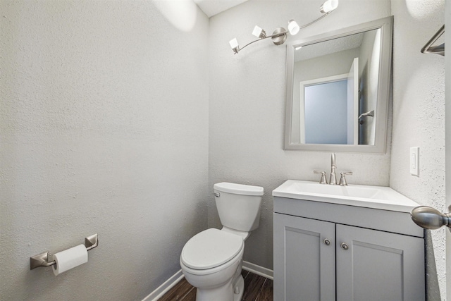 bathroom with toilet and vanity