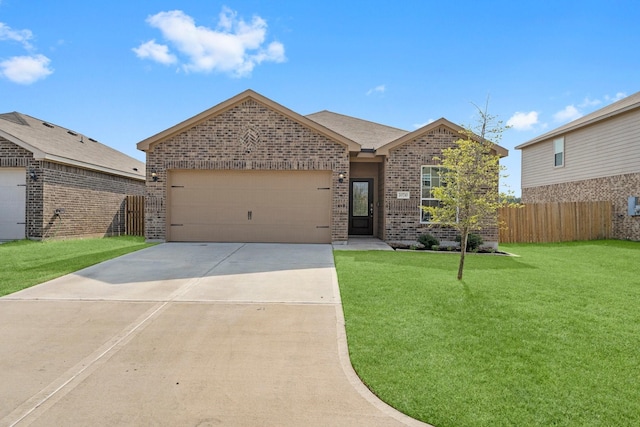 view of front of home featuring a front yard and a garage