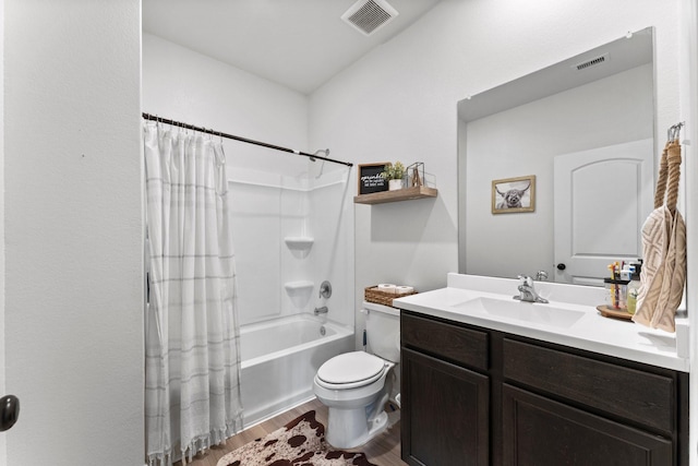 full bathroom with hardwood / wood-style flooring, toilet, vanity, and shower / tub combo