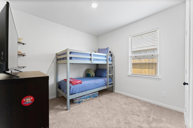 bedroom with light carpet