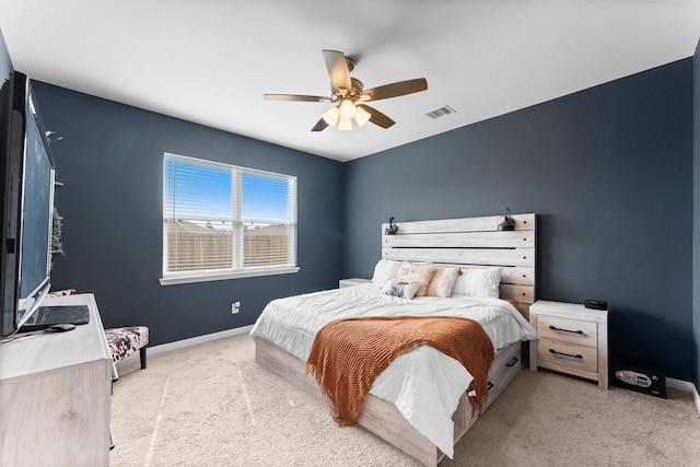 bedroom featuring ceiling fan and light colored carpet