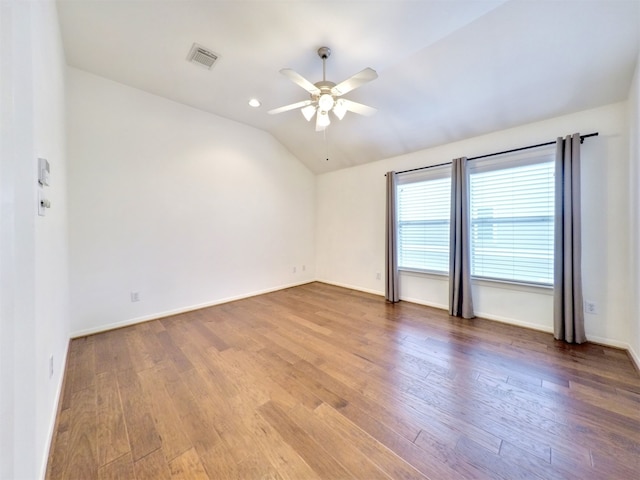 unfurnished room featuring vaulted ceiling, ceiling fan, and wood-type flooring