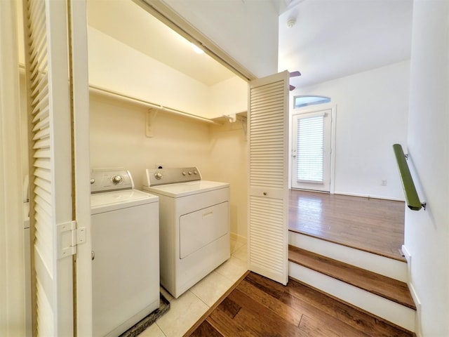 washroom with independent washer and dryer and light wood-type flooring