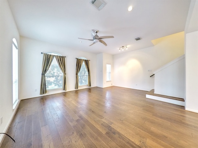 spare room featuring ceiling fan and hardwood / wood-style flooring