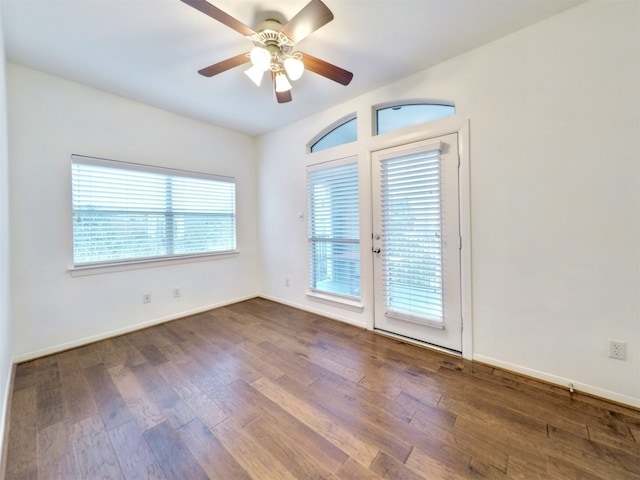 unfurnished room with french doors, ceiling fan, plenty of natural light, and wood-type flooring