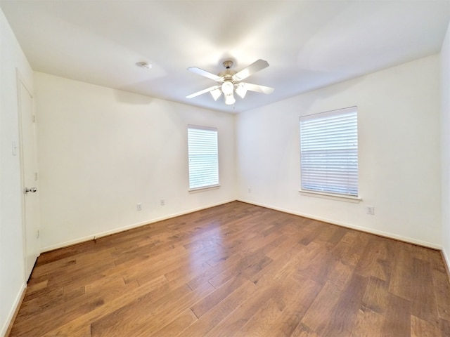 spare room with ceiling fan and hardwood / wood-style floors