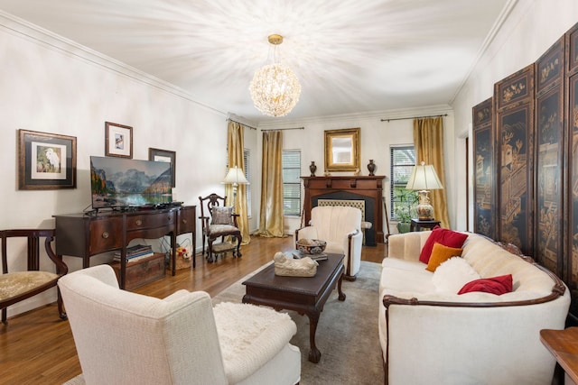 living room featuring a chandelier, crown molding, and hardwood / wood-style flooring