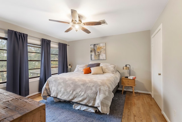 bedroom featuring ceiling fan and light hardwood / wood-style floors