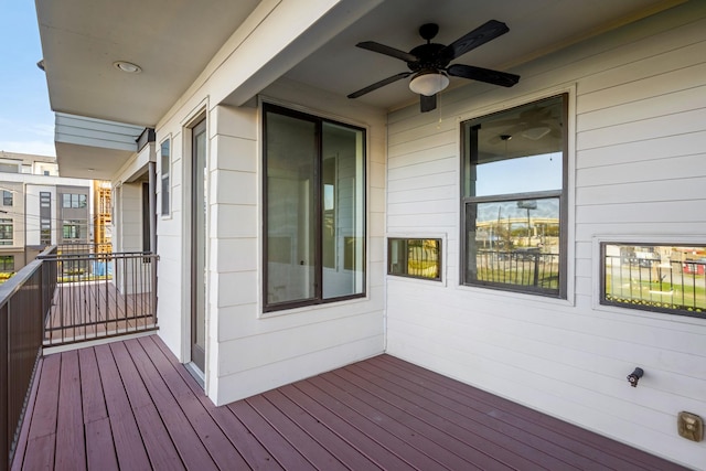 wooden terrace featuring ceiling fan