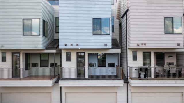 view of front of house featuring a balcony