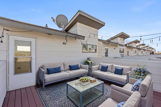 wooden terrace featuring an outdoor living space