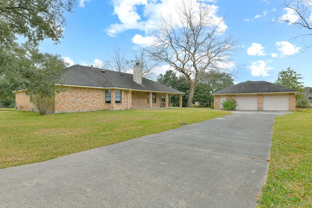 view of front of house with a front lawn and a garage