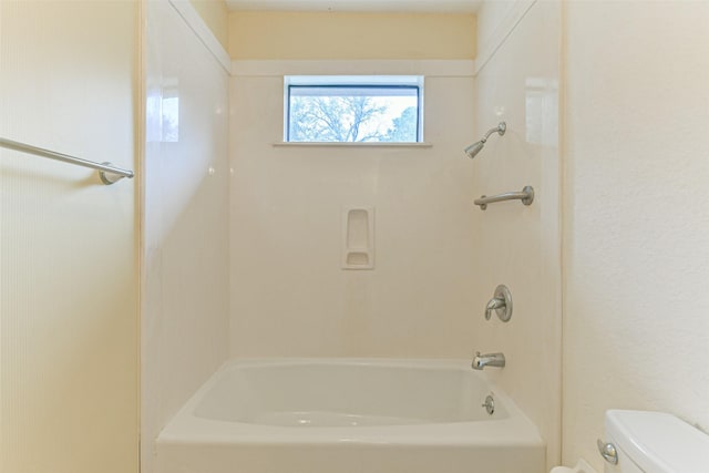 bathroom with toilet and shower / bathing tub combination