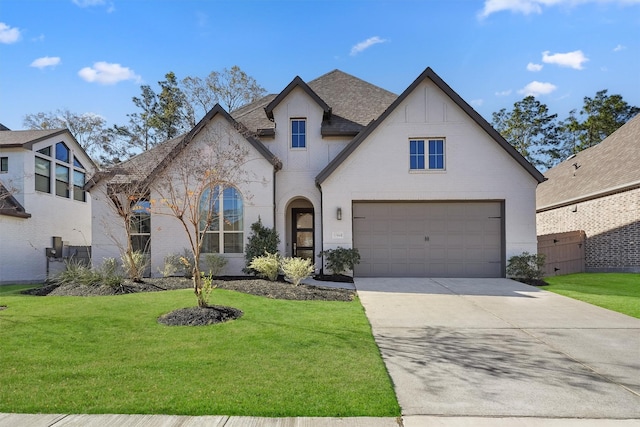 view of front facade featuring a front lawn and a garage