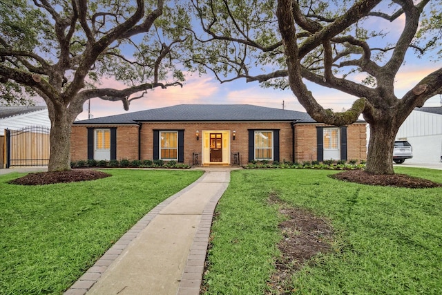 ranch-style house with a yard