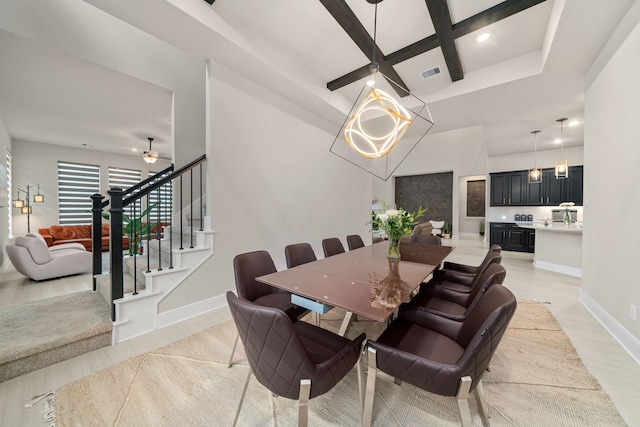 dining area with ceiling fan, light hardwood / wood-style flooring, beamed ceiling, and coffered ceiling