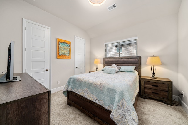 carpeted bedroom featuring lofted ceiling