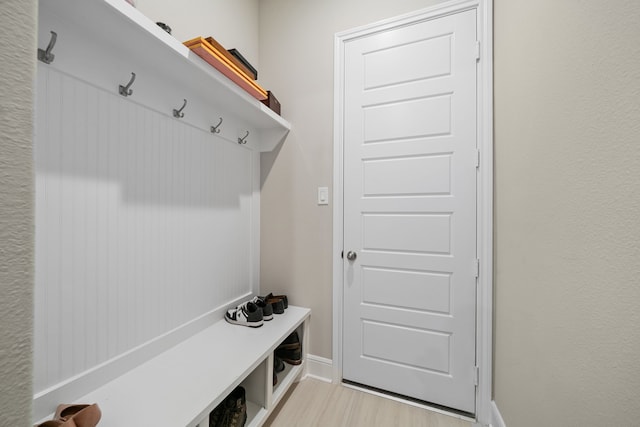 mudroom with light hardwood / wood-style floors